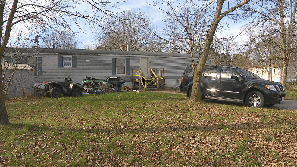 Police tape covers the porch of a town of Oneida home Nov. 11, 2025, after three adults living there were arrested in a child neglect case. (WLUK image)