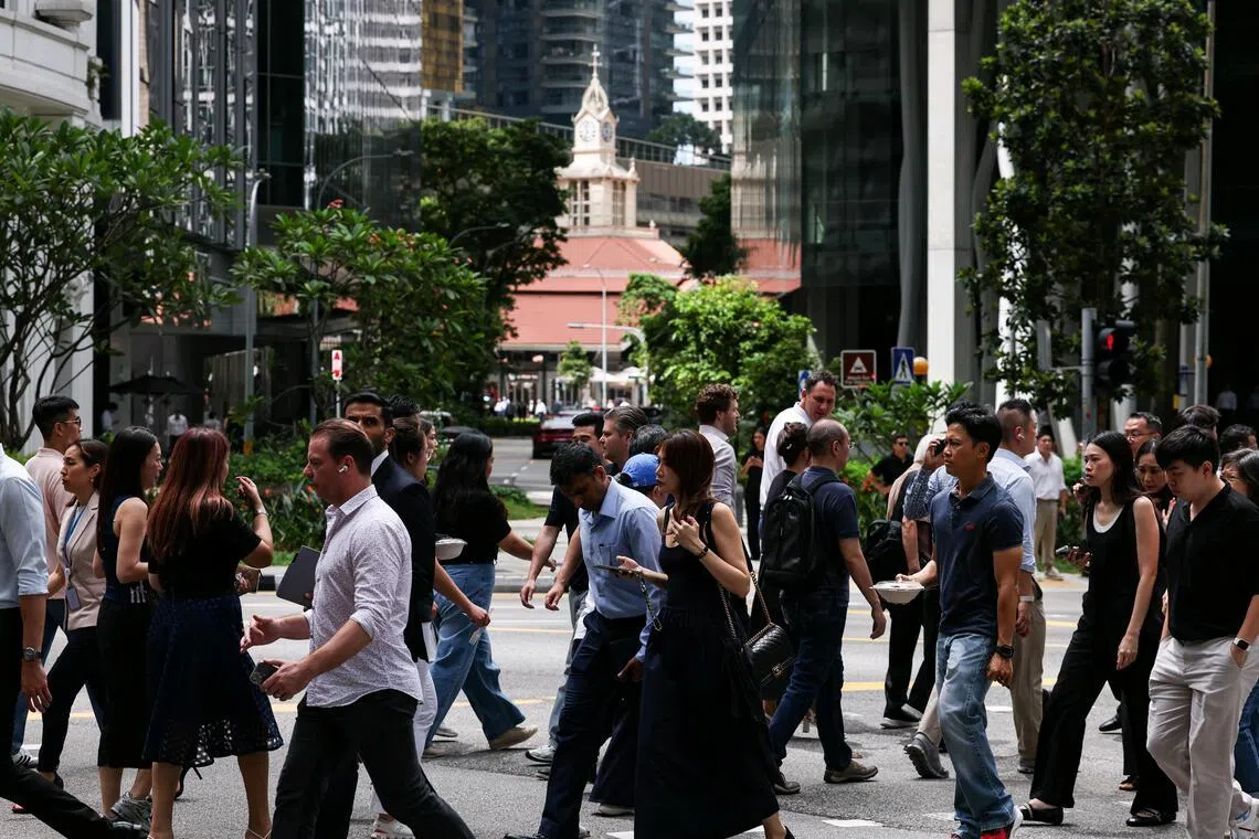 Generic of office workers at Raffles Place on May 12, 2026. Can be used for stories on Economic Strategy Review (ESR), economy, workers, workforce. ST PHOTO: BRIAN TEO