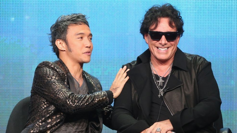 BEVERLY HILLS, CA - AUGUST 06:  (L-R) Lead vocalist Arnel Pineda and guitarist Neal Schon speak onstage during the "Don't Stop Believin': Everyman's Journey" panel at the PBS portion of the 2013 Summer Television Critics Association tour at the Beverly Hilton Hotel on August 6, 2013 in Beverly Hills, California.  (Photo by Frederick M. Brown/Getty Images)