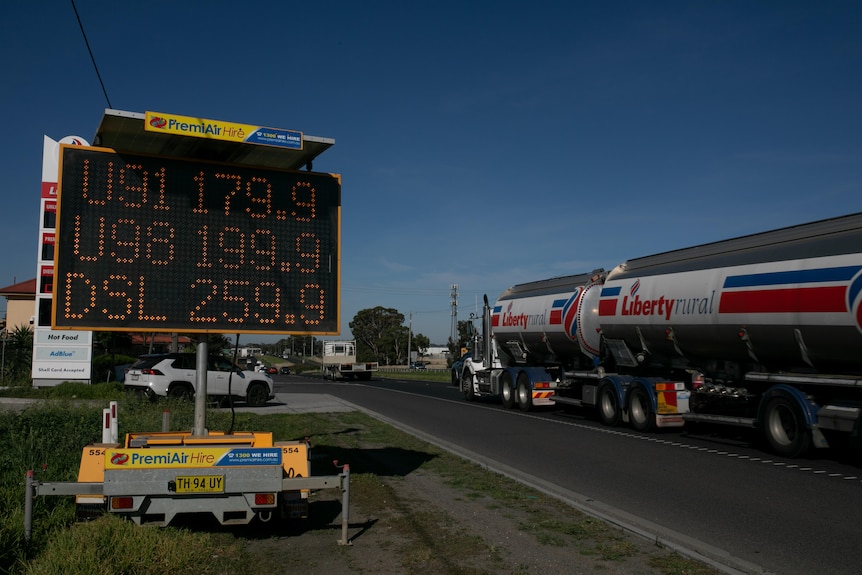 An election sign showing the price of fuel, with unleaded between $1.79 and nearly $2, and diesel at nearly $2.60 a litre.