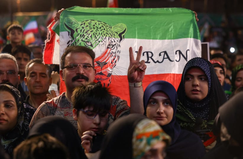 A man gestures as people gather at a farewell ceremony for Iran's national soccer team ahead of their departure to the 2026 World Cup, in Tehran, Iran, May 13, 2026. (credit: MAJID ASGARIPOUR/WANA