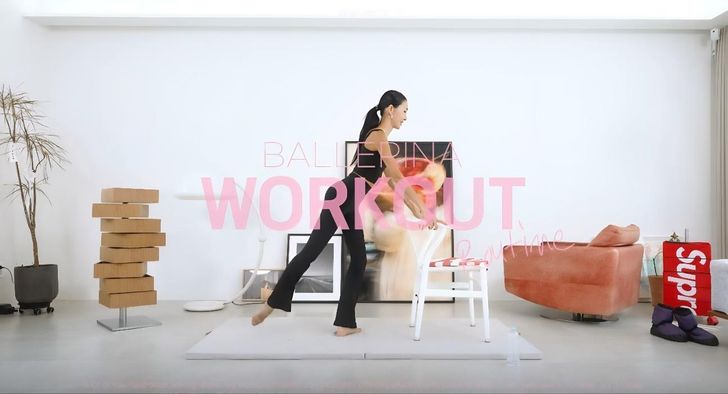 Former ballet dancer Yoon Hye-jin holds the back of a chair while demonstrating her lower body workout routine. Captured from YouTube