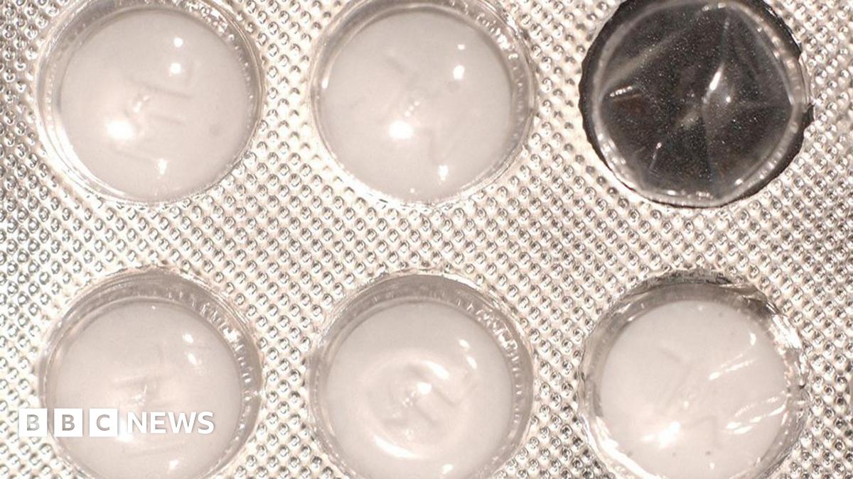 Close up of a blister pack of white tablets with one of the windows empty. The plastic package which features a dimpled, foil wrapper, contains five round tablets.