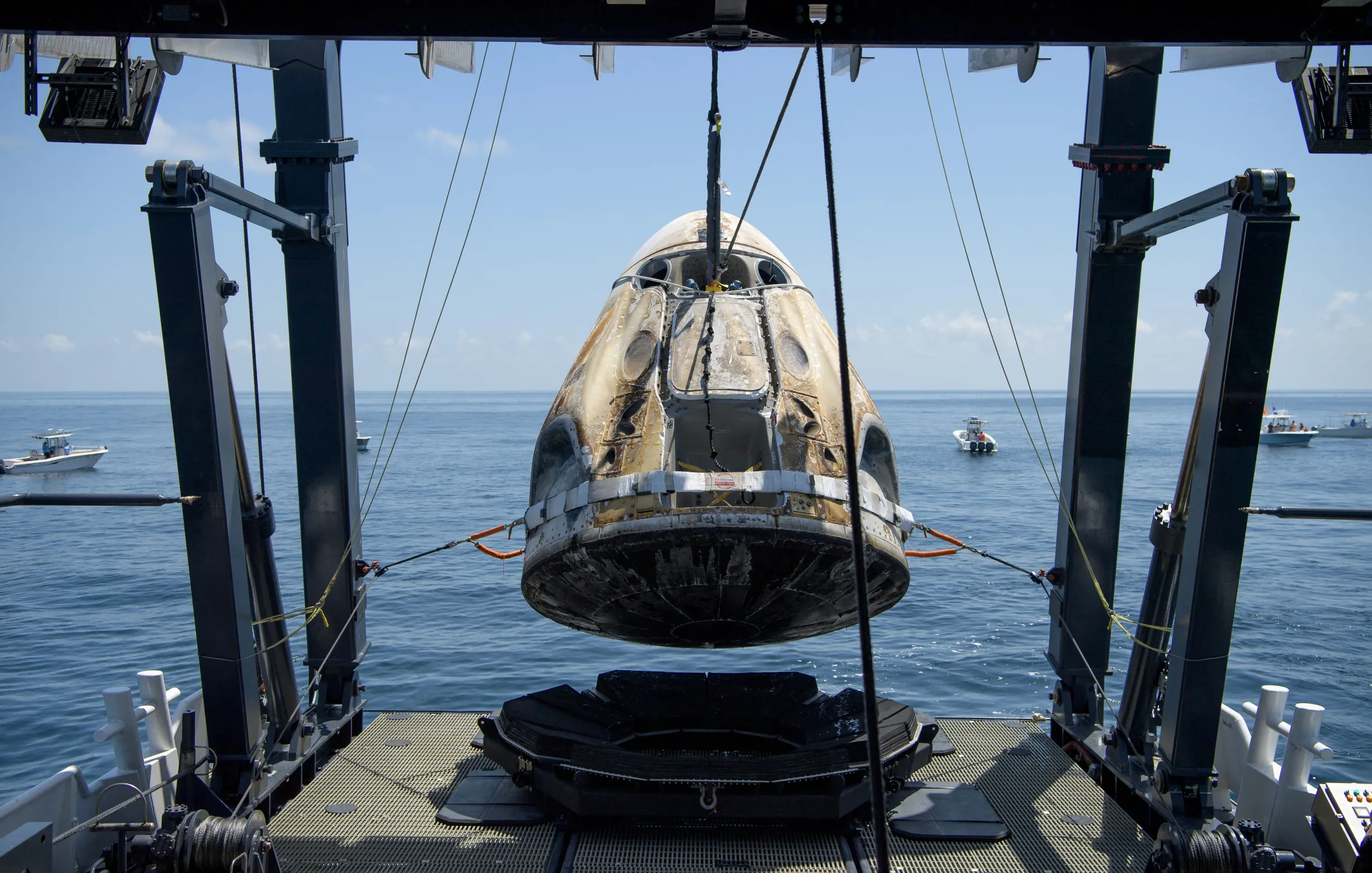 SpaceX Crew Dragon Endeavour spacecraft is lifted onto the SpaceX GO Navigator recovery ship.