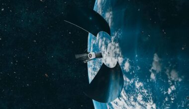 Artist's illustration of a spacecraft in earth orbit, with a number of small satellites below it