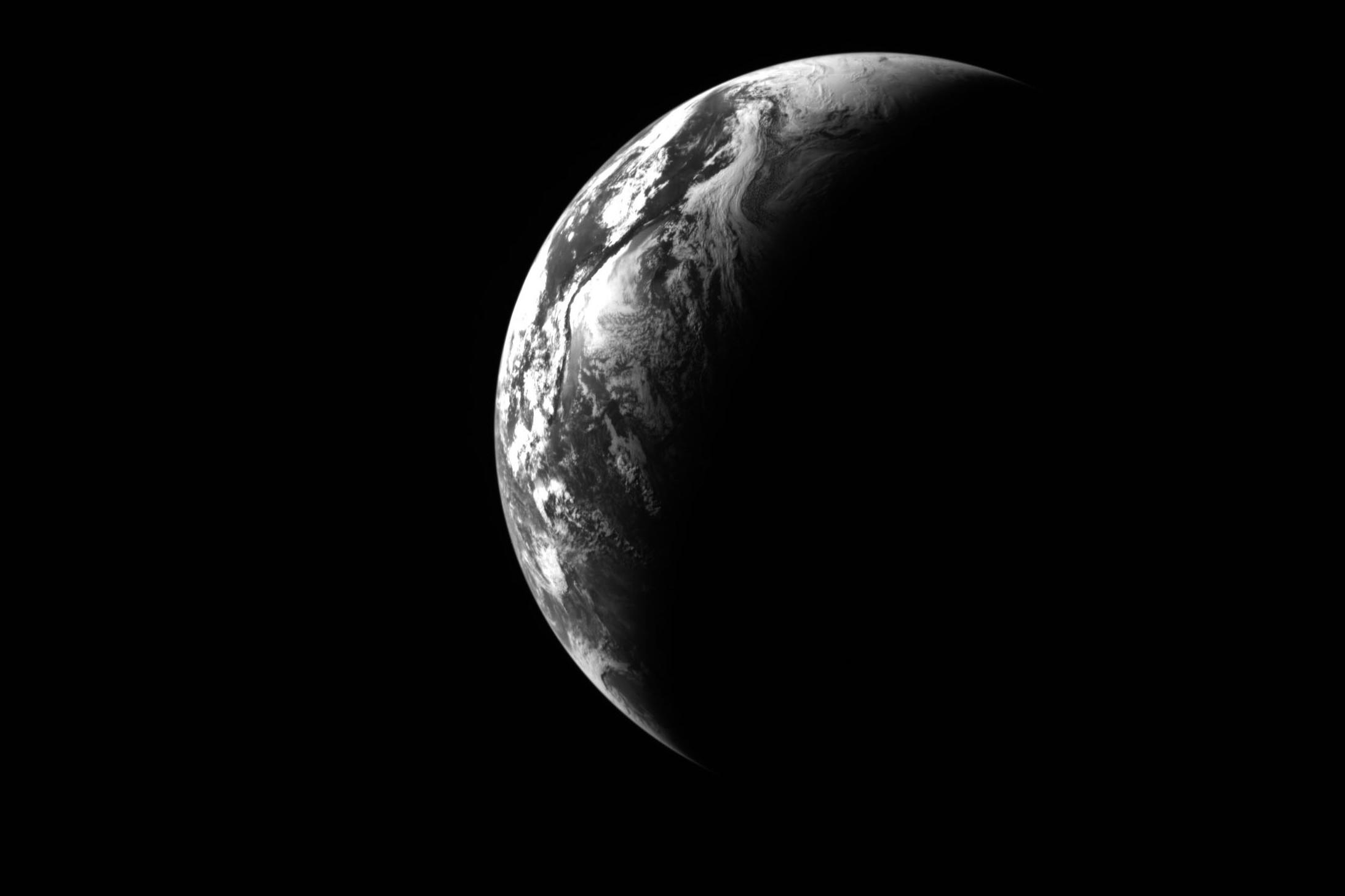 a black and white crescent Earth