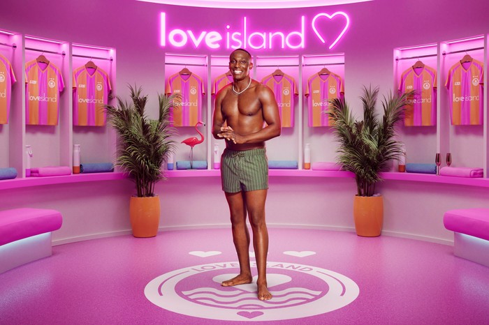 Ope. Ope in front of a pink Love Island 2026 background.