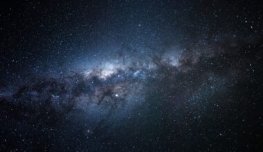 a bright white-blue smudge of gas in a starry night sky