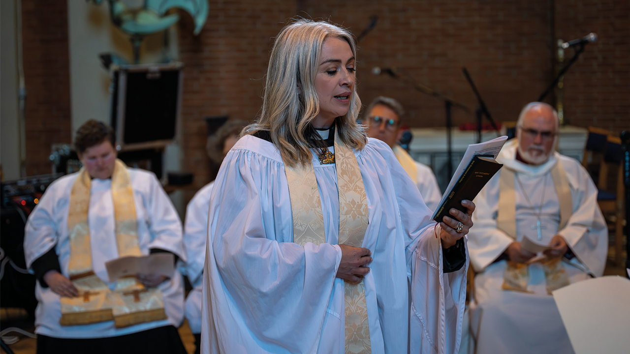 Reverend Emily Kolltveit singing a hymn