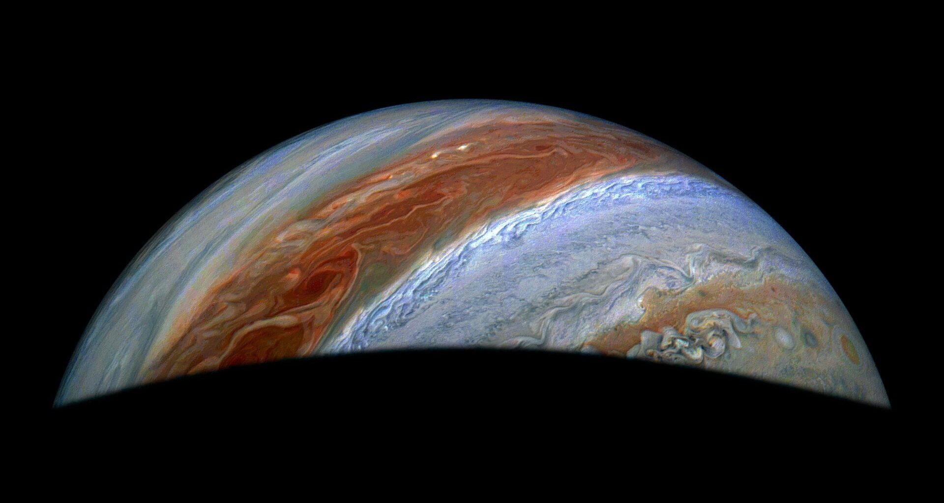 JunoCam, the visible light imager aboard NASA's Juno, captured this view of Jupiter's northern high latitudes during the spacecraft's 69th flyby of the giant planet on Jan. 28, 2025. Jupiter's belts and zones stand out in this enhanced color rendition, along with the turbulence along their edges caused by winds going in different directions.  Credits: Image data: NASA/JPL-Caltech/SwRI/MSSS, Image processing: Jackie Branc (CC BY)