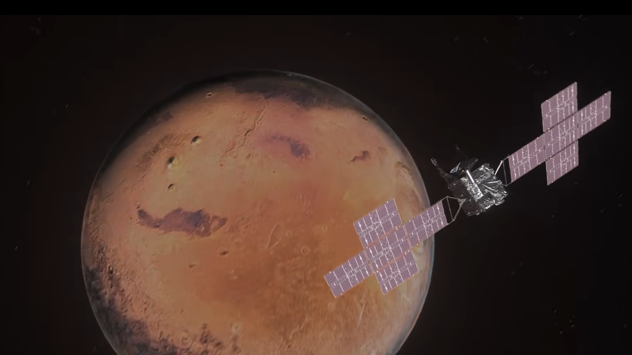 An animation of NASA's Psyche spacecraft flying by Mars.