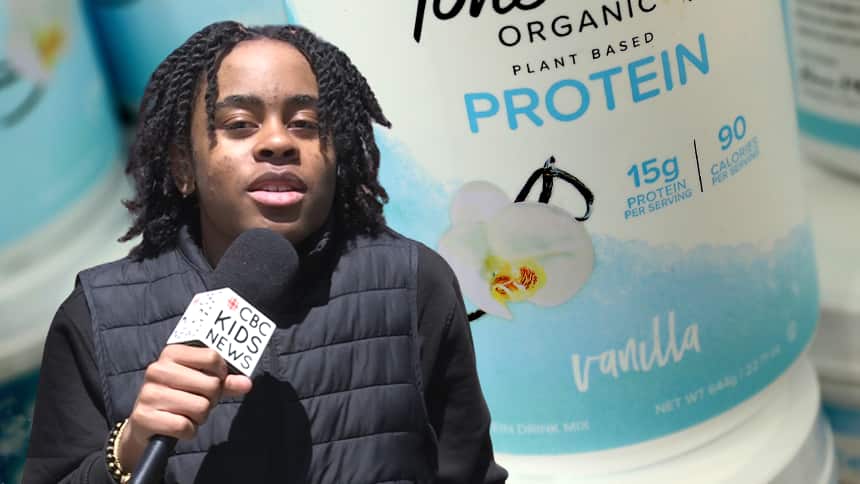 A kid stands, speaking into a handheld microphone, and the background has an image of protein powder.