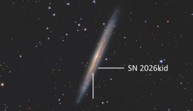 Deep-sky photos: A large and thin, yellowish object with a large white tick mark pointing at a star near the center.