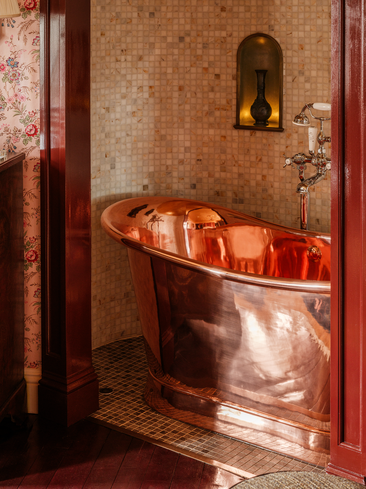 freestanding copper bath in alcove