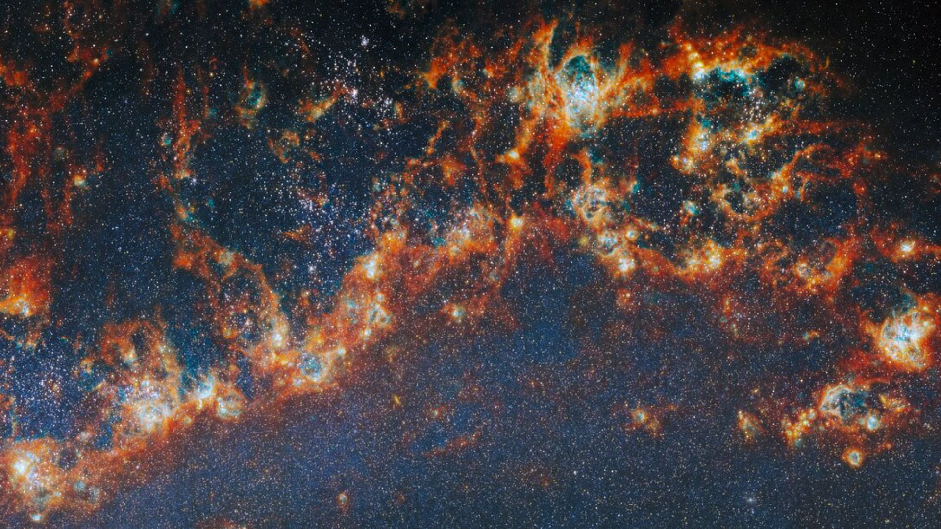 Red and orange streaks against a dark blue starry section of space.