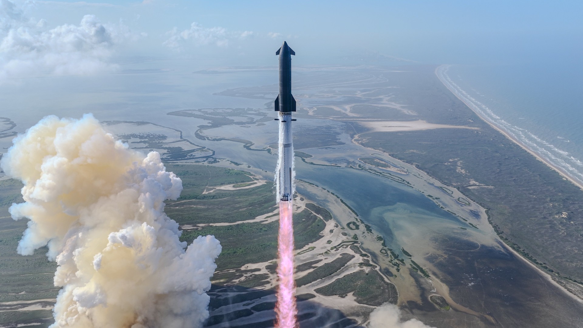 a large silver rocket launches above a plume of fire