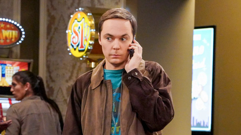 Sheldon (Jim Parsons) holding a cell phone to his ear on 
