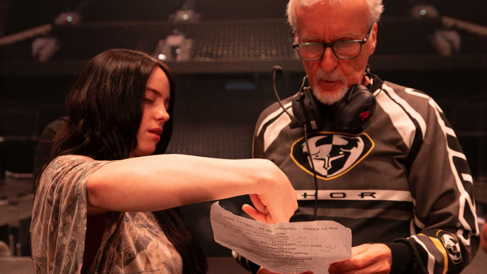 Billie Eilish and James Cameron talking together in Hit Me Hard and Soft The Tour