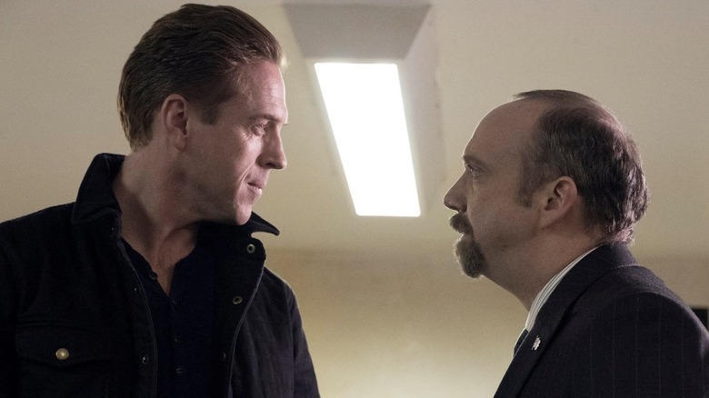 Damian Lewis as Bobby Axelrod facing down Paul Giamatti as Chuck Rhoades in Billions