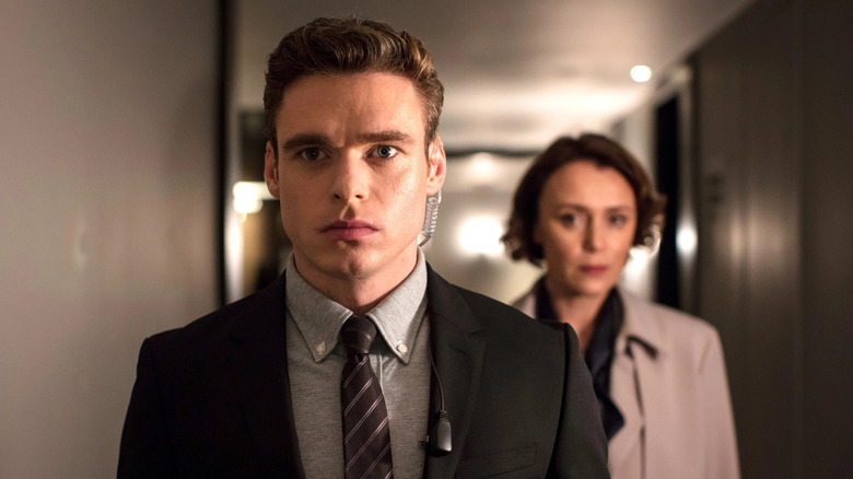 David Budd guides Julia Montague down a hallway in Bodyguard