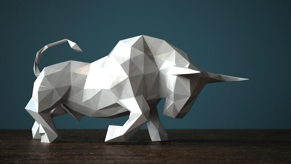 A geometric white bull with its head lowered, ready to charge.