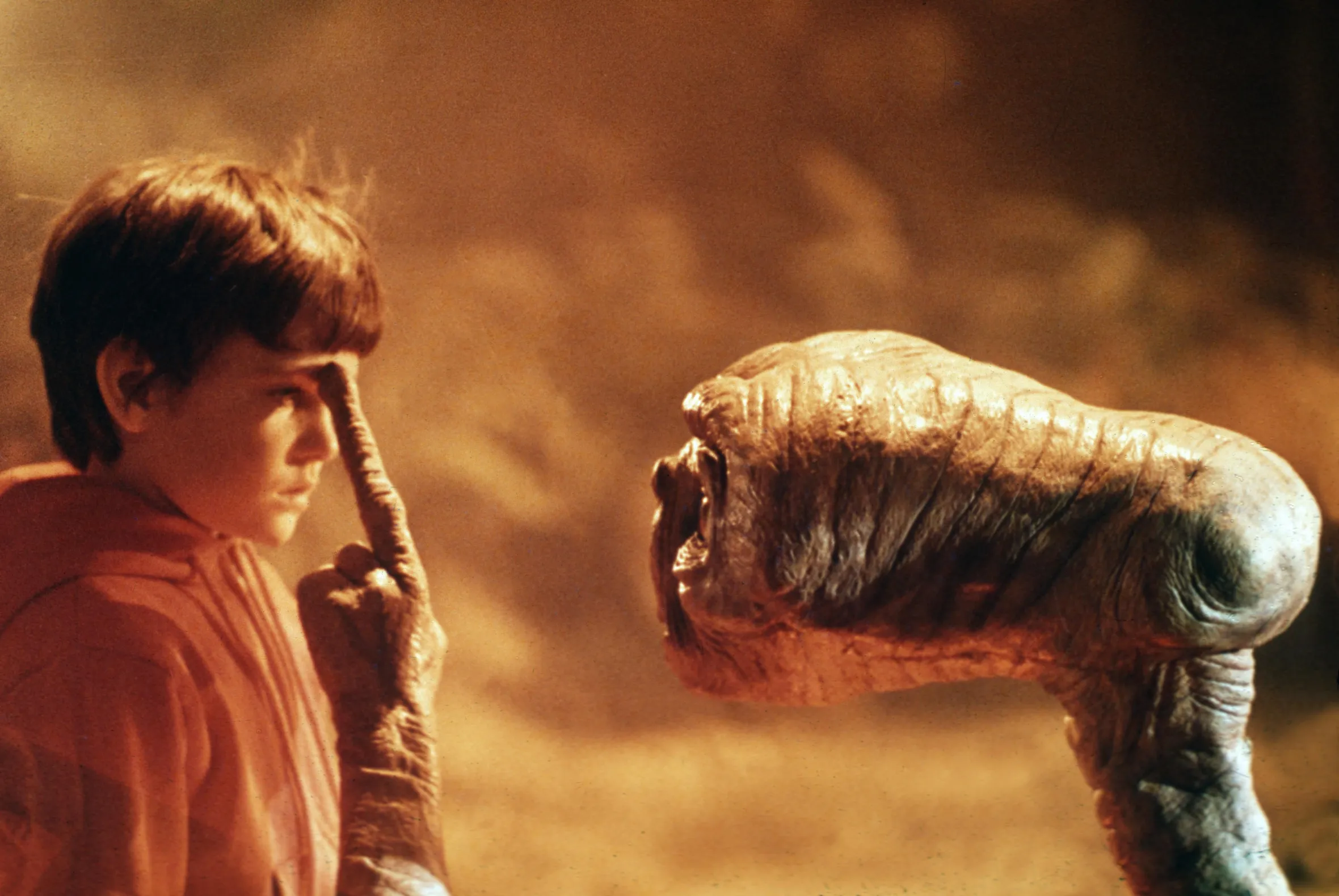 Henry Thomas and E.T. touching fingers in a scene from "E.T. the Extra-Terrestrial."