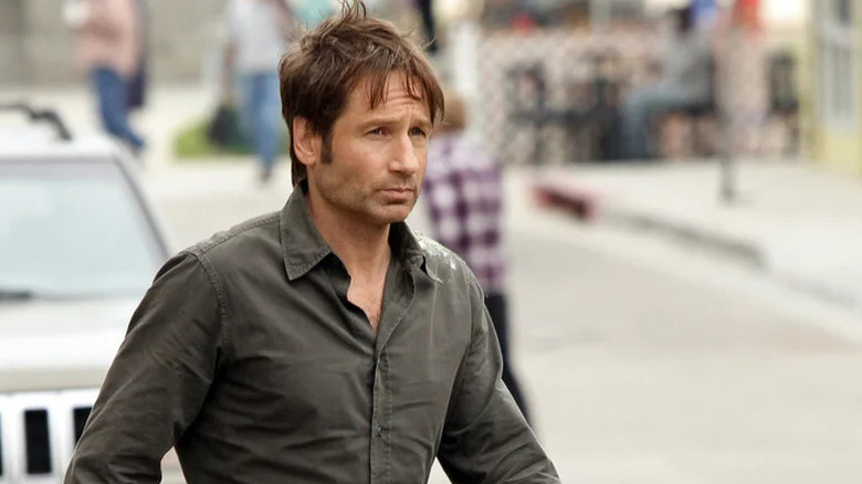 David Duchovny as Hank Moody walking across the street in Californication