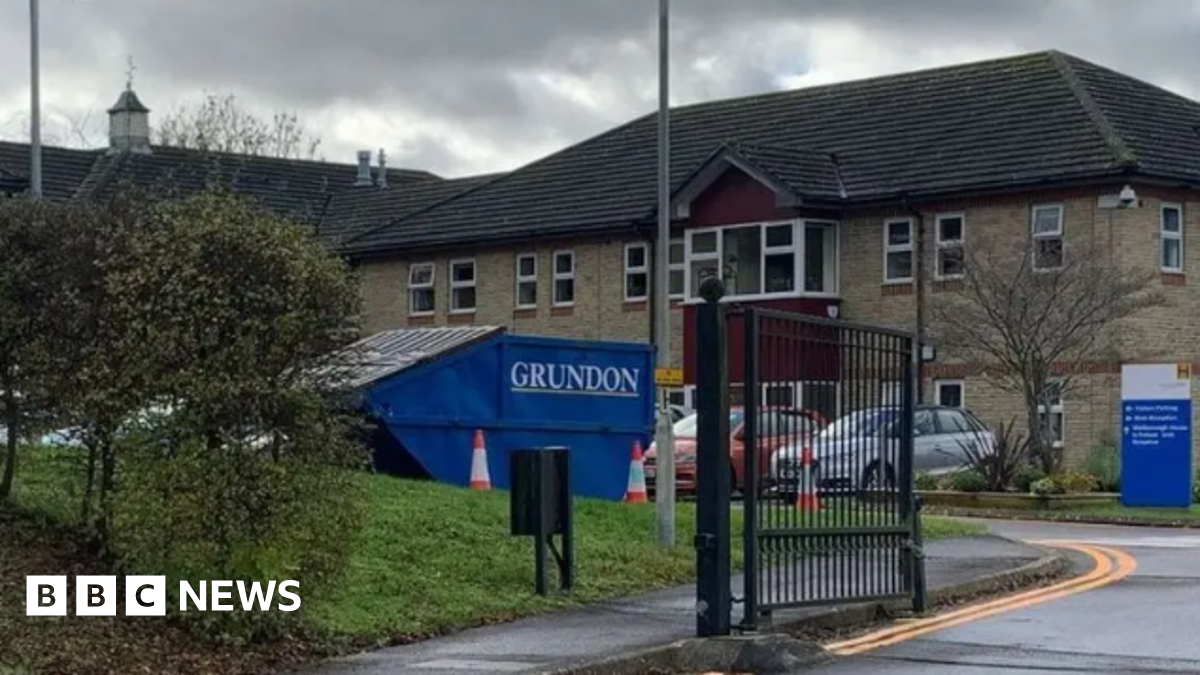 Marlborough House in Swindon. It is a brick building with a car park and a gated entrance.