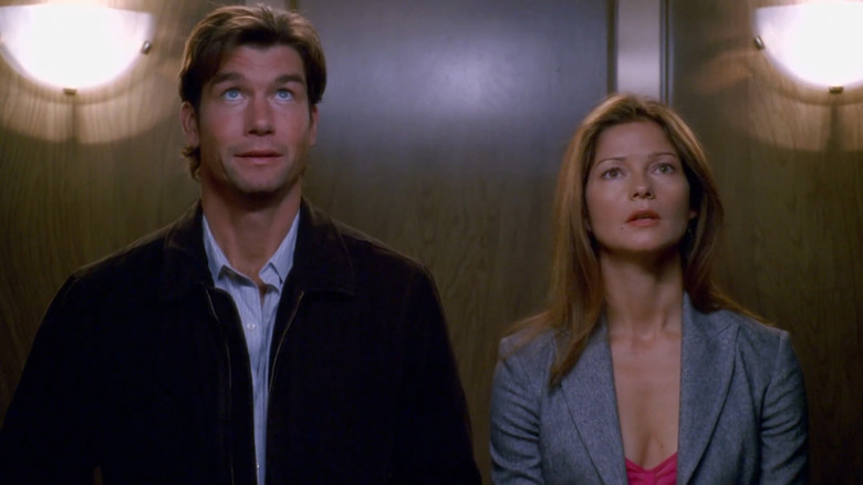 Jerry O'Connell as Woody and Jill Hennessy as Jordan standing in elevator in Crossing Jordan