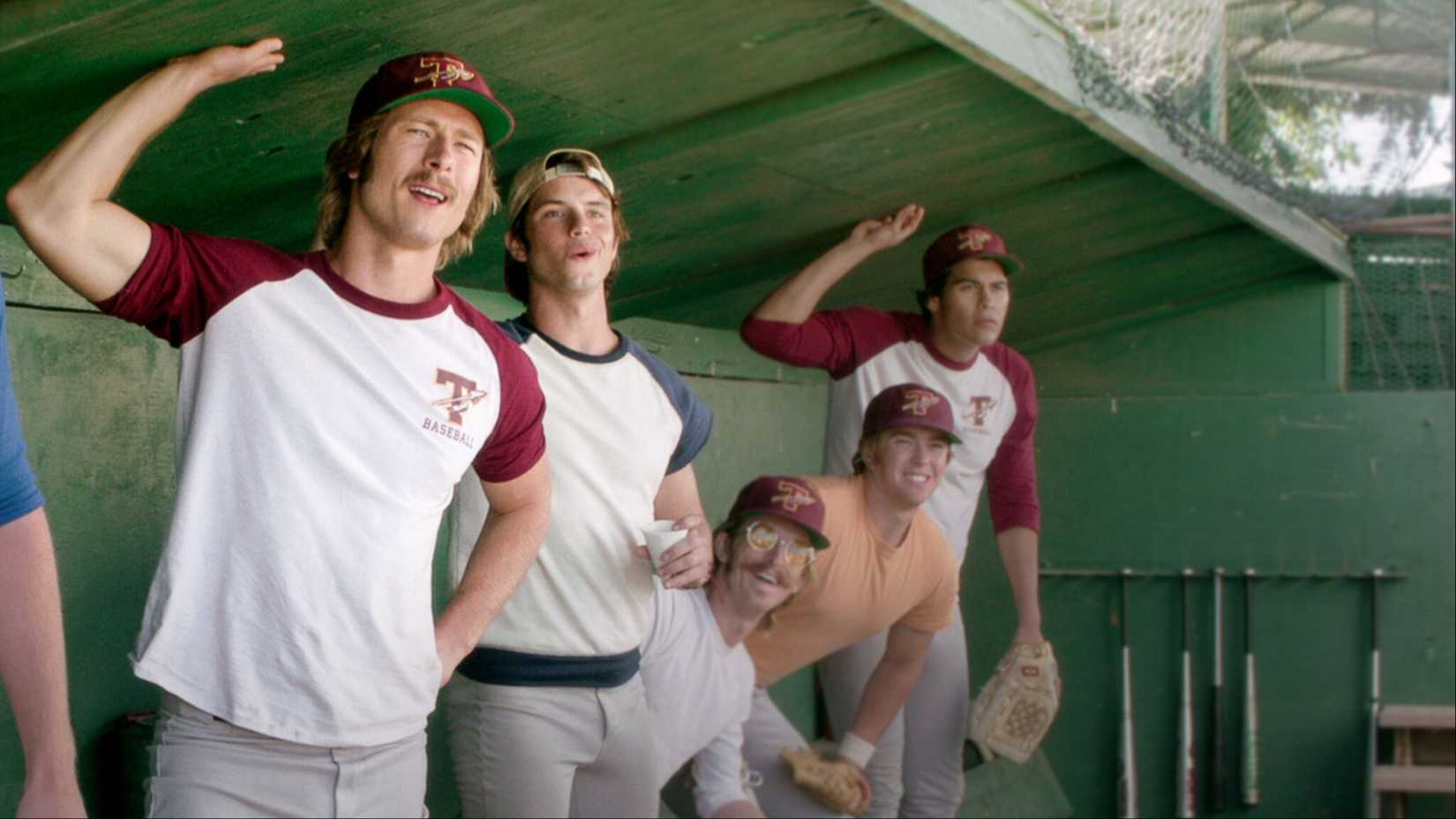 Baseball players in the dugout in Everybody Wants Some.