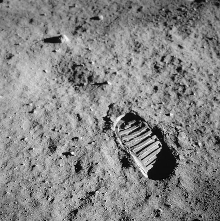A close-up view of an astronaut's bootprint in the lunar soil.