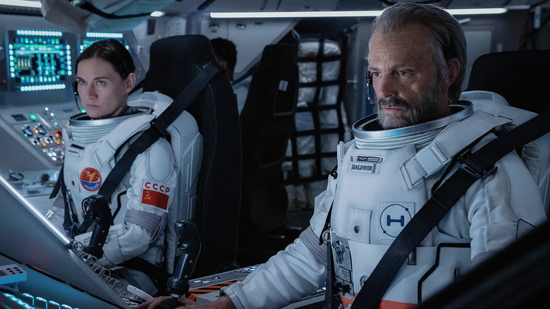 Masha Mashkova and Joel Kinnaman as Svetlana Zakharova and Ed Baldwin, piloting a spacecraft in For All Mankind.
