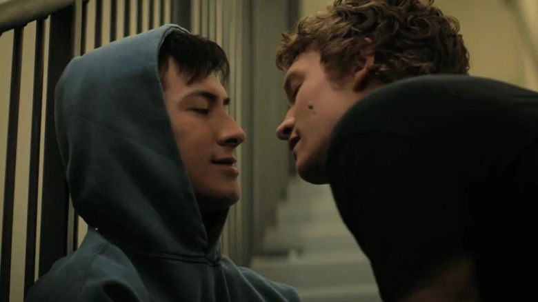 Hudson Williams and Connor Storrie as Shane and Ilya smiling at each other in Heated Rivalry