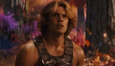 very muscular young man with wave blond hair in a He-Man costume.