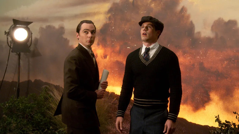 Jim Parsons and Jake Picking as Henry Wilson and Rock Hudson, standing together on a film set on the TV show Hollywood.