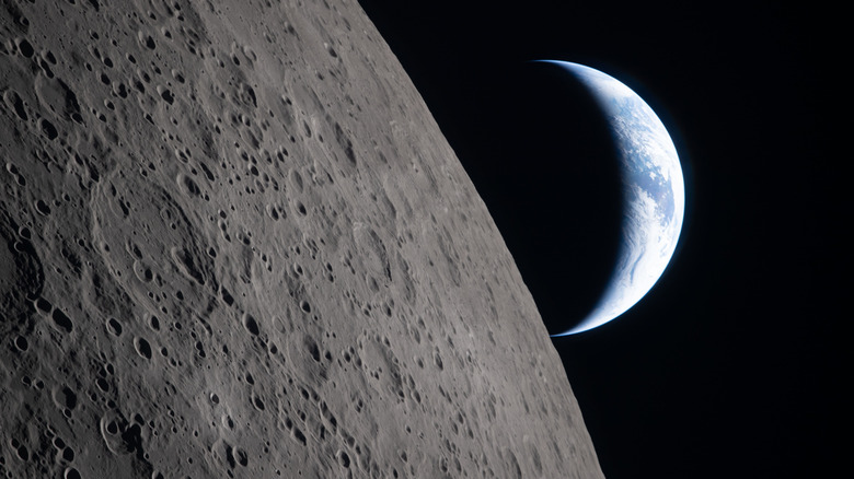 A photo from the Artemis II mission showing the Moon in the foreground and the Earth in crescent in the background
