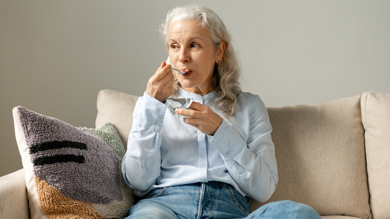 Woman having yoghurt