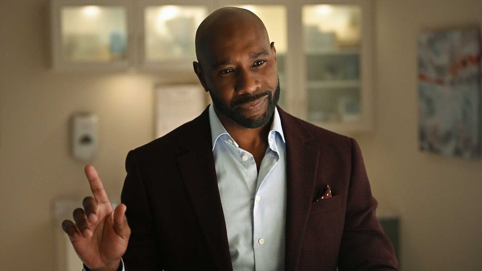 Morris Chestnut as John Watson smiling in Watson episode 2.