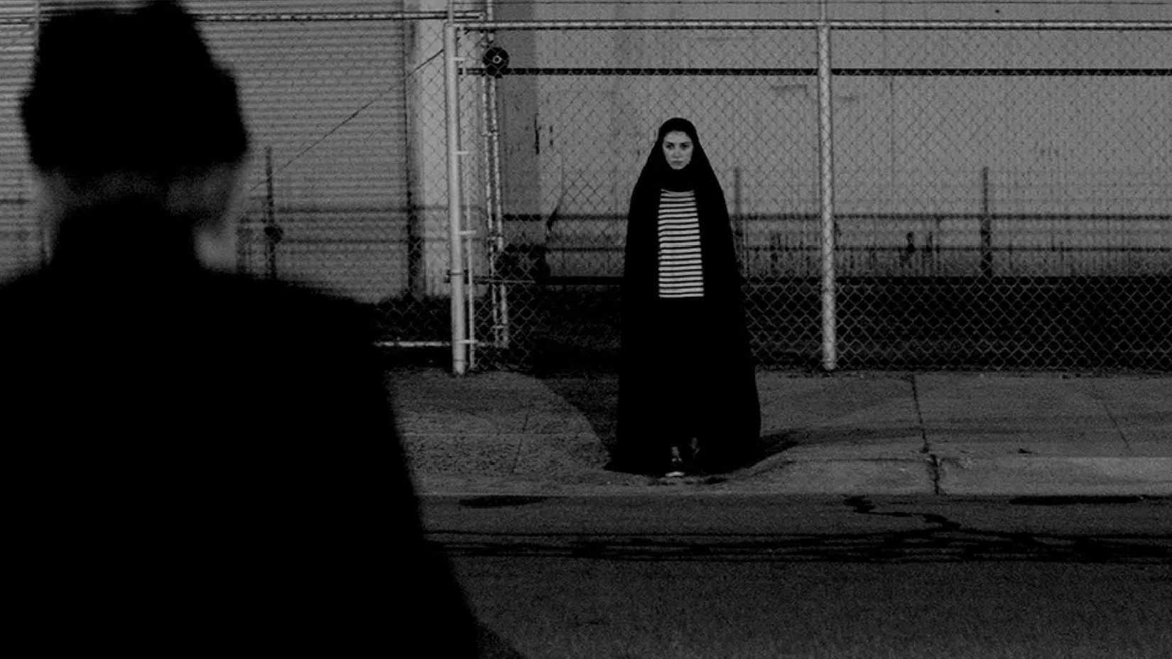 movie still from a girl walks home alone at night
