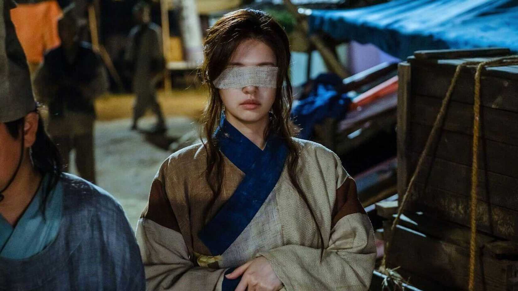 A woman wears a strip of cloth over her eyes in the fantasy K-drama Alchemy of Souls.