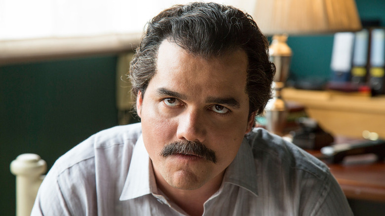 Pablo Escobar looks up glaring in Narcos