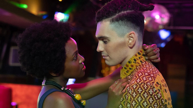 Masali Baduza as Persephone Hadley and Jack Rowan as Callum McGregor, looking into each others eyes on Noughts + Crosses.