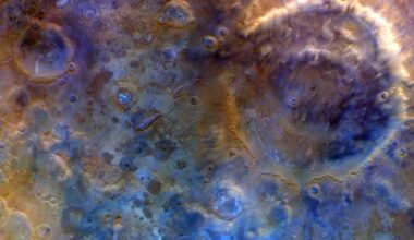 A close up of the surface of Mars, with blue and red colors.
