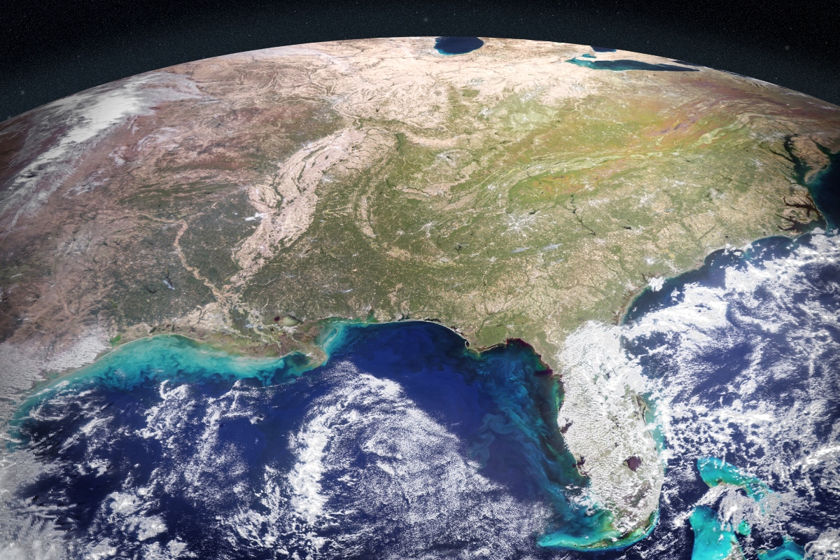 Satellite view of the eastern United States from space during autumn, showing the curve of the Earth, changing leaf colors across the Appalachian Mountains, and vibrant turquoise sediment plumes swirling in the Gulf of Mexico.