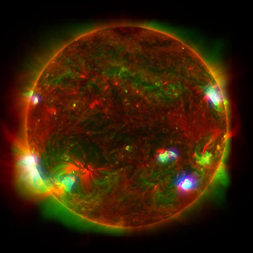  shows the bright light of a solar flare on the left side of the sun and an eruption of solar material shooting through the sun’s atmosphere, called a prominence eruption