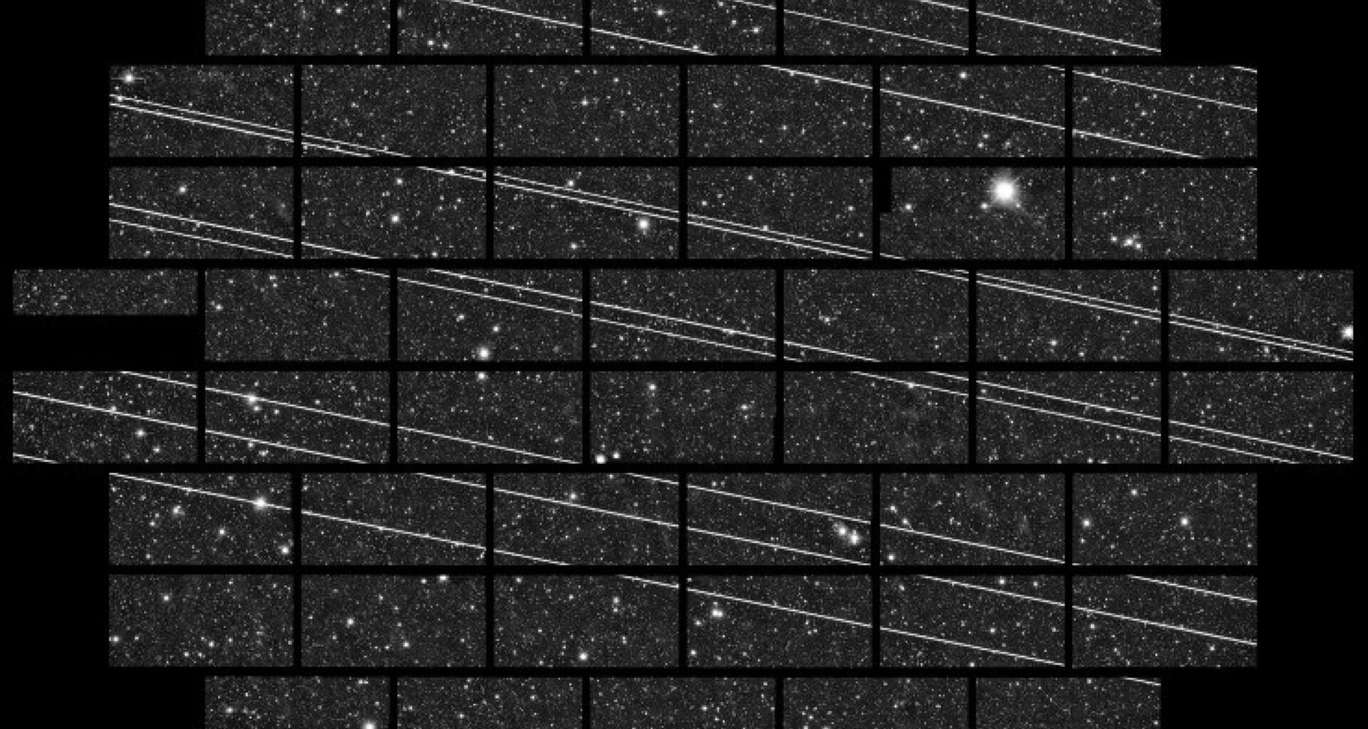 A series of gray squares with white dots and streaks across them.