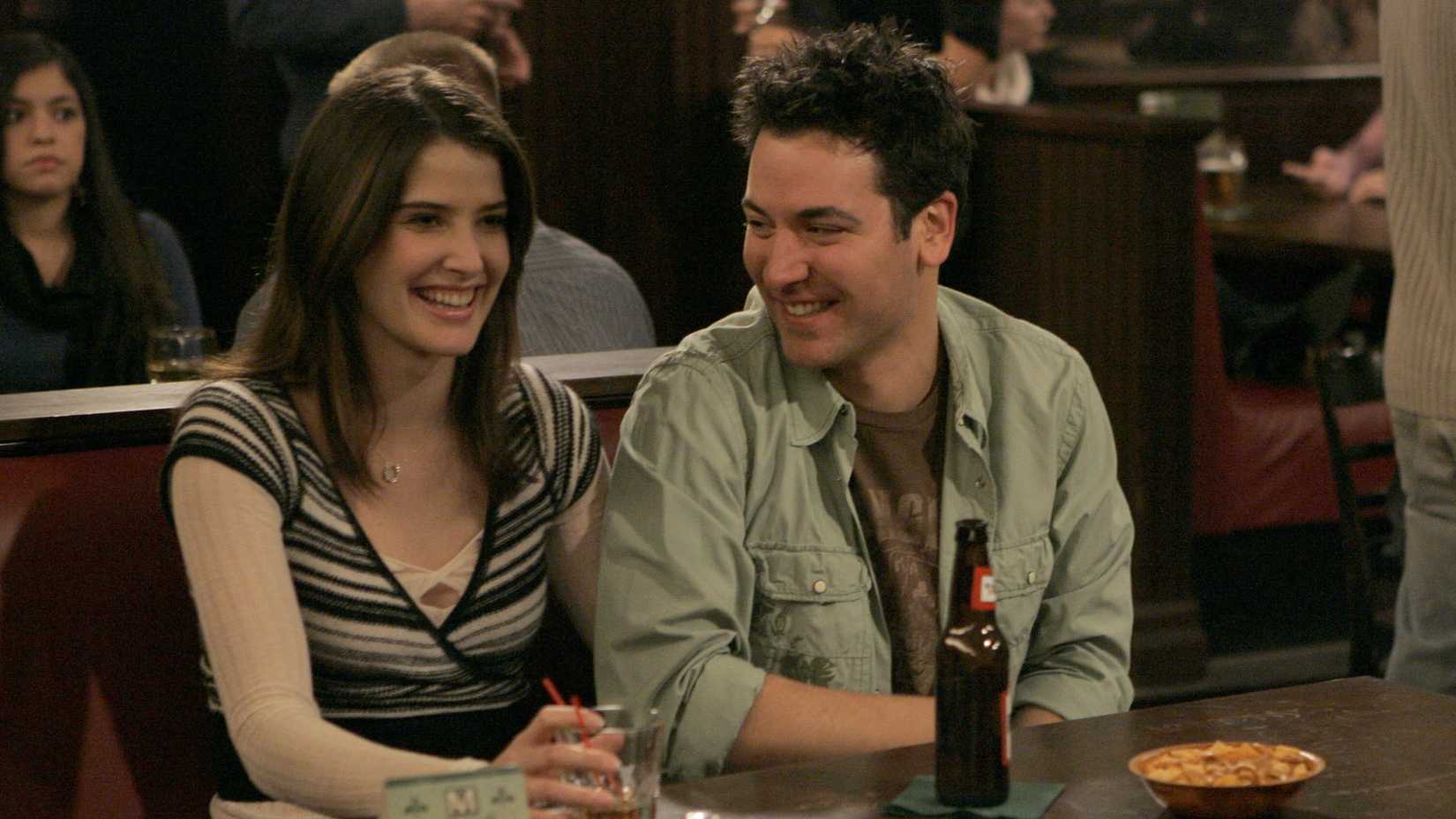 Robin and Ted laughing in McLaren's bar in How I Met Your Mother.