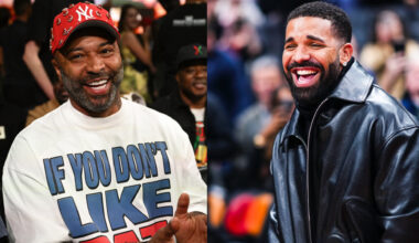 Two men smiling: Joe Budden in a red cap and graphic tee, Drake in a black leather jacket.