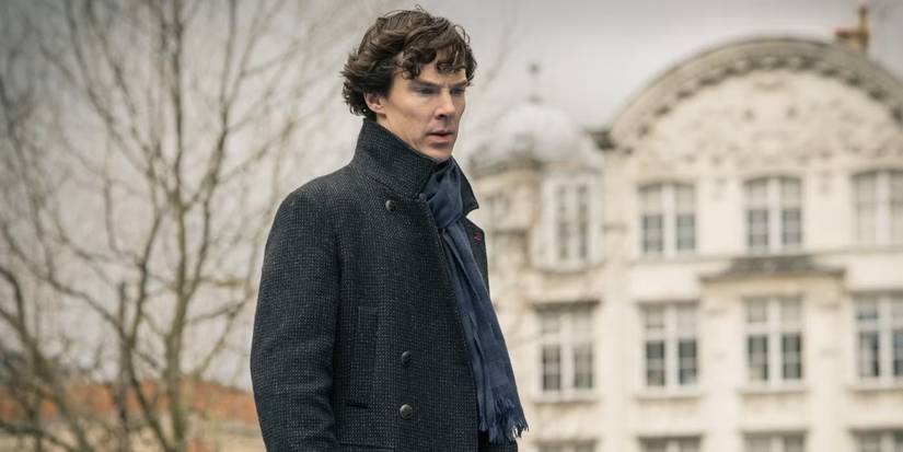 Sherlock Holmes (Benedict Cumberbatch) stands looking somber and contemplatice in 'Sherlock.'