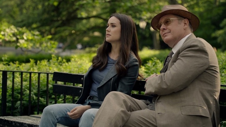 Liz Keen sitting on park bench next to Raymond Reddington